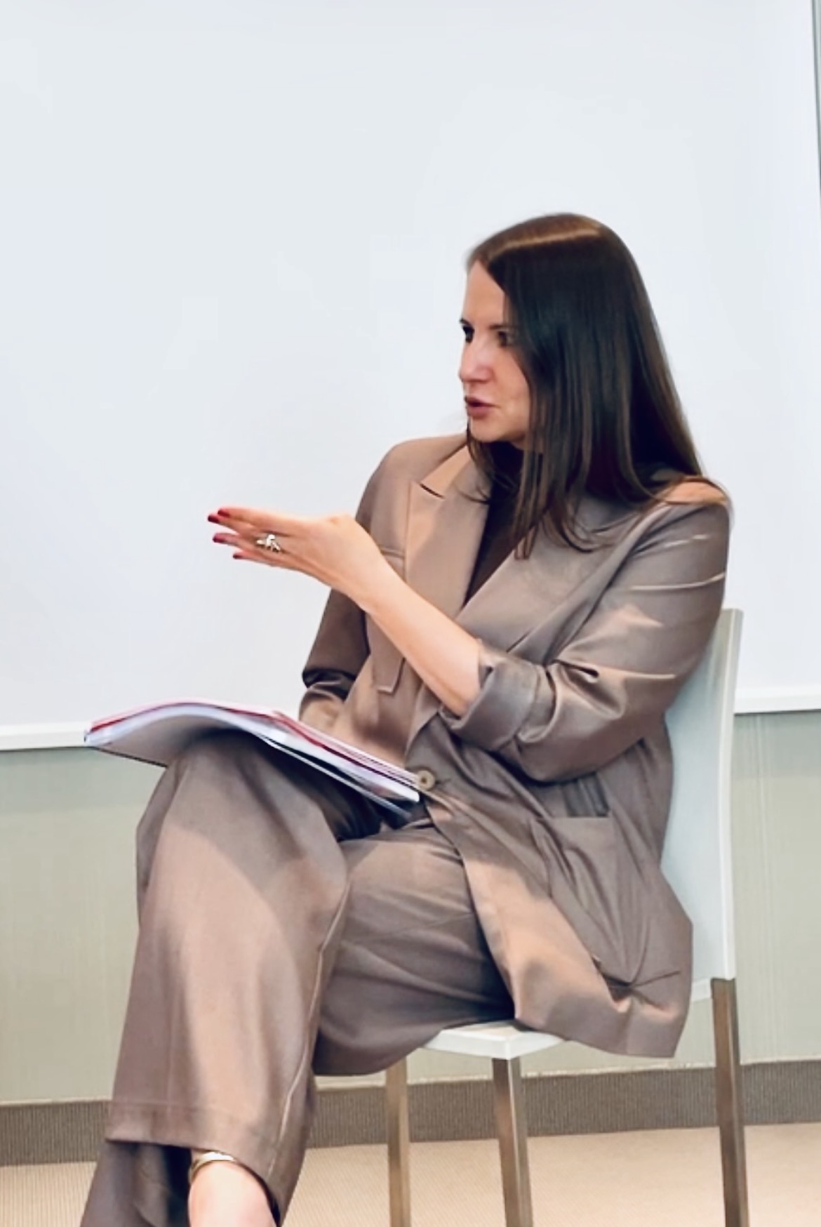 Sylvana Kozak speaking during a panel talk